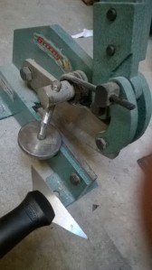 Metal shear and handle of putty knife after cutting